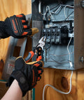 An electrician uses 8 Inch Pro Series Diagonal Cutting Pliers With Dual Material Grips to cut wire in a circuit breaker box.