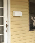 Windsor Small Capacity Rust Proof White Plastic Wall Mount Mailbox on porch, lightweight and durable, ample space for letters
