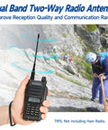 Person holding 6 Inch Dual Band VHF UHF Antenna for Handheld Ham Radios, SMA Female Connector, as climber ascends rocky slope.