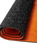Heavy Duty Oil Spill Mat For Garage Floors 64 By 32 Inches With Rubber Backing Absorbent Pad showing rolled mat with orange underside.