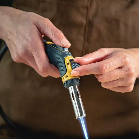 Person using Pro Grade Precision Flame Hand Torch With Adjustable Heat For MAP Pro Propane Fuel for jewelry making