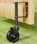 Real Deal Four Inch Spring Loaded Gate Wheel For Outside Wood Fences With Anti Sag Support Roller and Easy Roll Three Sixty Spin Built Tough to Hold Two Hundred Twenty Pounds Stress Free In Matte Black One Piece mounted under wooden gate.