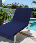 Two Pack Navy Blue Pool Lounge Chair Covers With Waffle Weave Cotton Terry Towels, Oversized 32 Inch Wide By 82 Inch Long Chaise Covers With A 7 Inch Pocket, Absorbent Beach Chair Towel Set by a poolside.