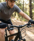 Cyclist using 21 Speed Twist Grip Shifter Set For Mountain Bikes 3X7 Gear Shifters With Cables and Handle Grips Replacement on trail