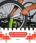 Mechanic installing a wheel using wrench with 4 Pack Bicycle Disc Brake Spacers, Lightweight Plastic for Hydraulic Disc Brakes visible