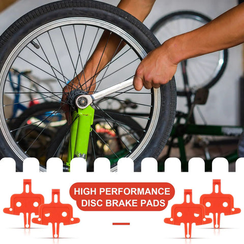 Mechanic installing a wheel using wrench with 4 Pack Bicycle Disc Brake Spacers, Lightweight Plastic for Hydraulic Disc Brakes visible