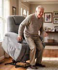 Elderly man using Power Lift Chair Massage Recliner For Seniors With Ergonomic Support Remote Control Built In Cup Holders And Side Pockets Easy Sit To Stand Lift Adjustable Recline Gray, in living room