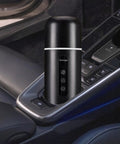 On The Go Electric Travel Mug With Fast Heating Element And Built In Magnetic Stirrer To Keep Your Daily Espresso Or Smooth Matcha Straight Up Hot All Day in a car cup holder.