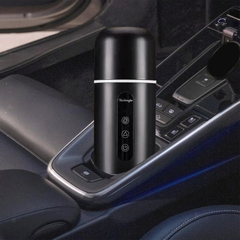 On The Go Electric Travel Mug With Fast Heating Element And Built In Magnetic Stirrer To Keep Your Daily Espresso Or Smooth Matcha Straight Up Hot All Day in a car cup holder.
