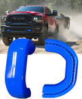 Blue Front Tow Hook Covers For RAM 2500 And 3500, 2019-2026, on a red Dodge RAM truck with hitch cover replacements displayed
