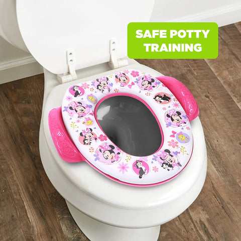 Disney Minnie Mouse Believe In Me Toddler Potty Seat With Super Cozy Cushion and No Fuss Easy Grip Handles Fits Regular And Elongated Toilets on a toilet.