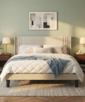 Prime Queen Bed Frame With Plush Wingback Headboard And Heavy Duty Steel Base For Ultimate Lounge Comfort And Durable Support To Kick Back And Rock Your Bedroom Setup, styled with neutral bedding and nightstands.