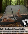 Ultra Dense Mosquito Tent With Foldable Mesh For Single Person Keeps NoSeeUms Out With TightWeave Net Perfect For Camping Travel Patio Includes Storage Bag Black featured in a forest setting with a double-zipper.