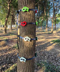 16 Piece Kids Climbing Rocks Set With Zip Line Accessories Non Slip Tree Rock Holds installed on a tree in a forest setting
