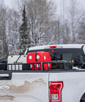 High Roller Foam Archery Target Cube With 21 Bullseyes, 13 Inch by 13 Inch, on a truck bed in snowy landscape