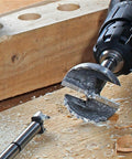 Close-up of Sweet Setup 16 Piece Forstner Drill Bit Set Nailed It Precision Hole Cutters on wood, highlighting clean cuts.