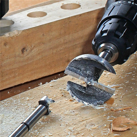 Close-up of Sweet Setup 16 Piece Forstner Drill Bit Set Nailed It Precision Hole Cutters on wood, highlighting clean cuts.