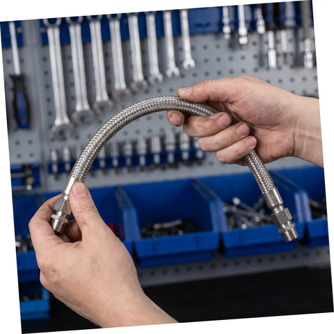 Badass Half Inch Stainless Steel Braided Air Hose High Pressure Heat Resistant Jumper For Industrial Air Compressor Pump Discharge Vibration Absorbing Heavy Duty Pro Grade Quality Keeps Moving Smooth Easy Install Shop Ready Top Tier, held by hands