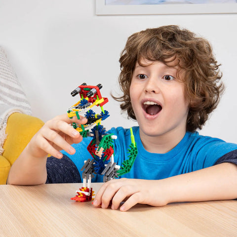 Adventure Wheels Building Set For Creative STEM Play, 480 Classic Pieces To Build Cars, Trucks, And More, Kid Approved, Mega Fun Build Kit For Ages 7 And Up, Amazon Exclusive; child holding model