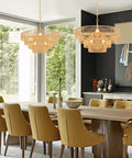 Dining room with two Six Light Hand Woven Rattan Pendant With Four Round Brass Frame Spheres over a long table