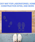 Sticky Adhesive Mats For Shoes And Equipment Wheels 24 By 36 Inch Heavy Duty Floor Mats Pack Of 150 Sheets Blue Great For Labs Homes Construction Sites And More Dust And Dirt Removal blue mat with shoe prints on wooden floor