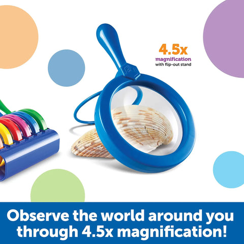 Blue magnifier from Six Jumbo Science Magnifiers With Stand For Kids Ages 3 Plus, Durable Plastic Lenses beside seashell.