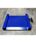 Built Tough Portable Drum Scale With Dual Side Ramps And Easy Roll Handles, Solid As A Rock 5000 Pound Platform Weigher shown on a concrete floor.