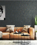 Living room with Peel And Stick Geometric Wallpaper In Dark Grey With Gold Hexagon Accents, leather sofa, and modern decor