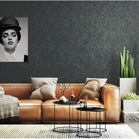 Living room with Peel And Stick Geometric Wallpaper In Dark Grey With Gold Hexagon Accents, leather sofa, and modern decor