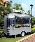 Premium Polished Mirror Food Trailer With Fold Down Awning And Stainless Steel Counter Space For Concession Operators And Mobile Coffee Shops Solid Gear To Crush Sales Daily, side view in a garden setting.