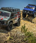 RockVan RC Crawler One Eighteenth Scale with Two Speed Transmission and All Metal Gears climbing rocky terrain.