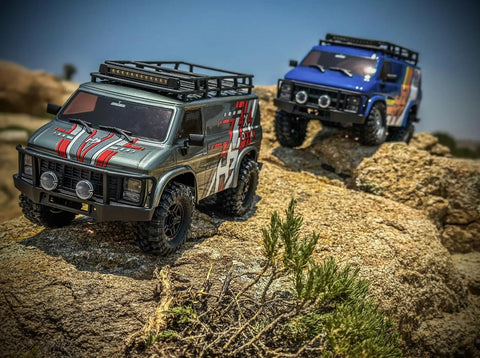 RockVan RC Crawler One Eighteenth Scale with Two Speed Transmission and All Metal Gears climbing rocky terrain.
