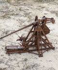 Mini Counterweight Trebuchet Model Kit for Adults, 3D Wooden Puzzle Siege Engine, DIY STEM Project, Tabletop Toy, Alder Veneer Plywood Build, Ages 14 Plus, Totally Fun Historical Replica on sandy ground