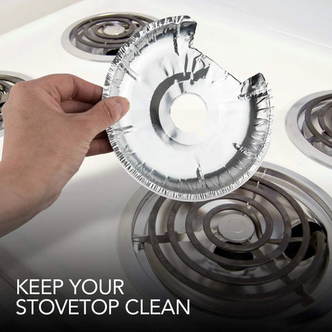 Hand placing Round Electric Stove Burner Covers 50 Pack 6 Inch And 8 Inch Disposable Aluminum Foil Stove Top Bib Liners on cooktop