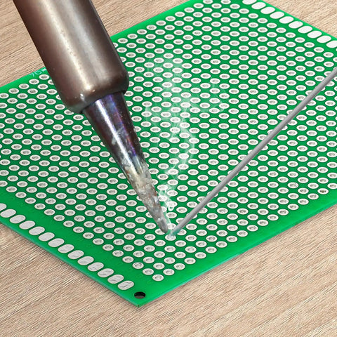 Soldering on a Double Sided PCB Board Prototype Kit For DIY Soldering With 32 Pieces In Five Sizes