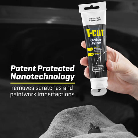 Person holding Color Fast Scratch Remover for Black Car Paint 5.3 Oz tube against car surface with cloth