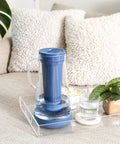Water Filter Pitcher 7 Cup Glass With Silicone Base Stormy Blue Removes Bacteria Parasites Microplastics Lead Mercury PFAS And A Range Of Chemicals For Everyday Tap Water Protection on a tray