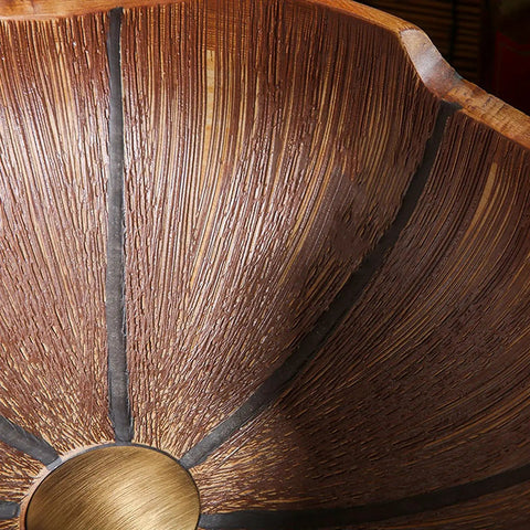 Close-up view of the USZWBY Bathroom Vessel Sink ceramic design with a textured surface and central drain.