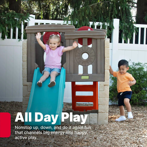 Two children playing on the Woodland Climber II Kids Playset With Toddler Slide And Climbing Wall, enjoying the outdoor fun.