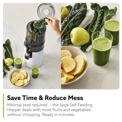 Hurom H70 Cold Press Juicer Easy To Clean Masticating Slow Juicer with leafy greens and juice glasses on countertop.