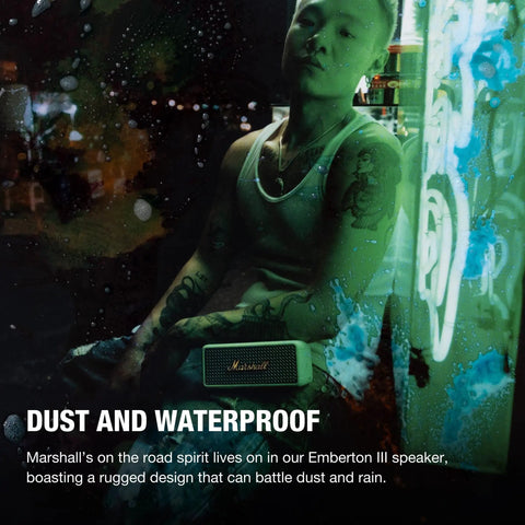 Person with Emberton III Portable Bluetooth Speaker With Rugged Waterproof Build And Dust Proof Design Loud Stereo Sound And Deep Bass.