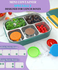 Lunch box with Leakproof 1.6 Ounce Stainless Steel Salad Dressing Containers With Lids On The Go inside, surrounded by fresh ingredients.