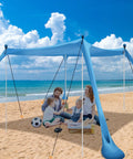 Family under Big Beach Canopy Sun Shelter 11 By 11 Feet UPF Fifty Plus With Sandbags on a sunny beach