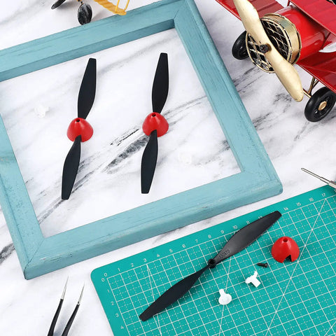 Three Spare RC Plane Propellers Set With Carbon Fiber Nose Cone Prop Savers And Adapters for TR-P51 4 Channel RC Plane on table