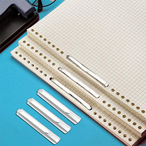 Heavy Duty Self Adhesive Ring Binders With Solid Steel Fasteners securing graph paper for organized file management.