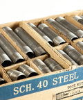 Close-up of Half Inch Black Steel Pipe Nipples And Fittings Assorted Pack For DIY Home Furniture Decor Sixty Six Piece Set.