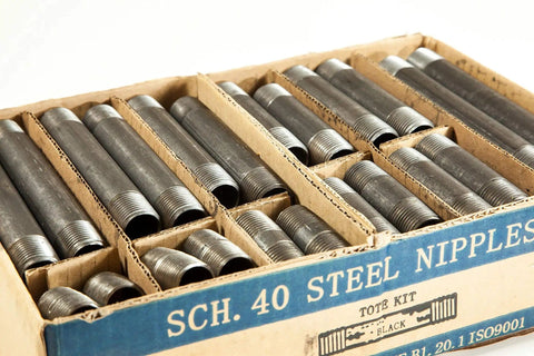 Close-up of Half Inch Black Steel Pipe Nipples And Fittings Assorted Pack For DIY Home Furniture Decor Sixty Six Piece Set.