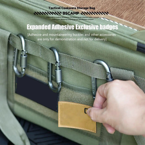 Hand holding handle of 36L Travel Duffle Bag with Shockproof Storage System showing durable olive-green material.