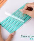 Hands peeling sheet of Blue Poster Putty Adhesive Reusable And Removable Sticky Tack For Wall Art And Photos 120 Pre Cut Squares