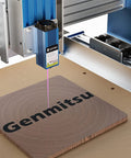 5.5W Fixed Focus Laser Module Kit engraving wood on CNC router with Genmitsu branding, 20mm fixed focus distance visible
